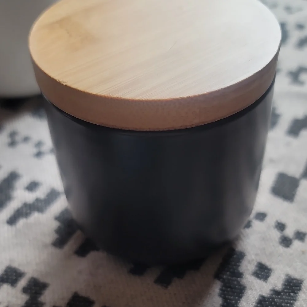 White and Black Ceramic Jars with Wooden Lids